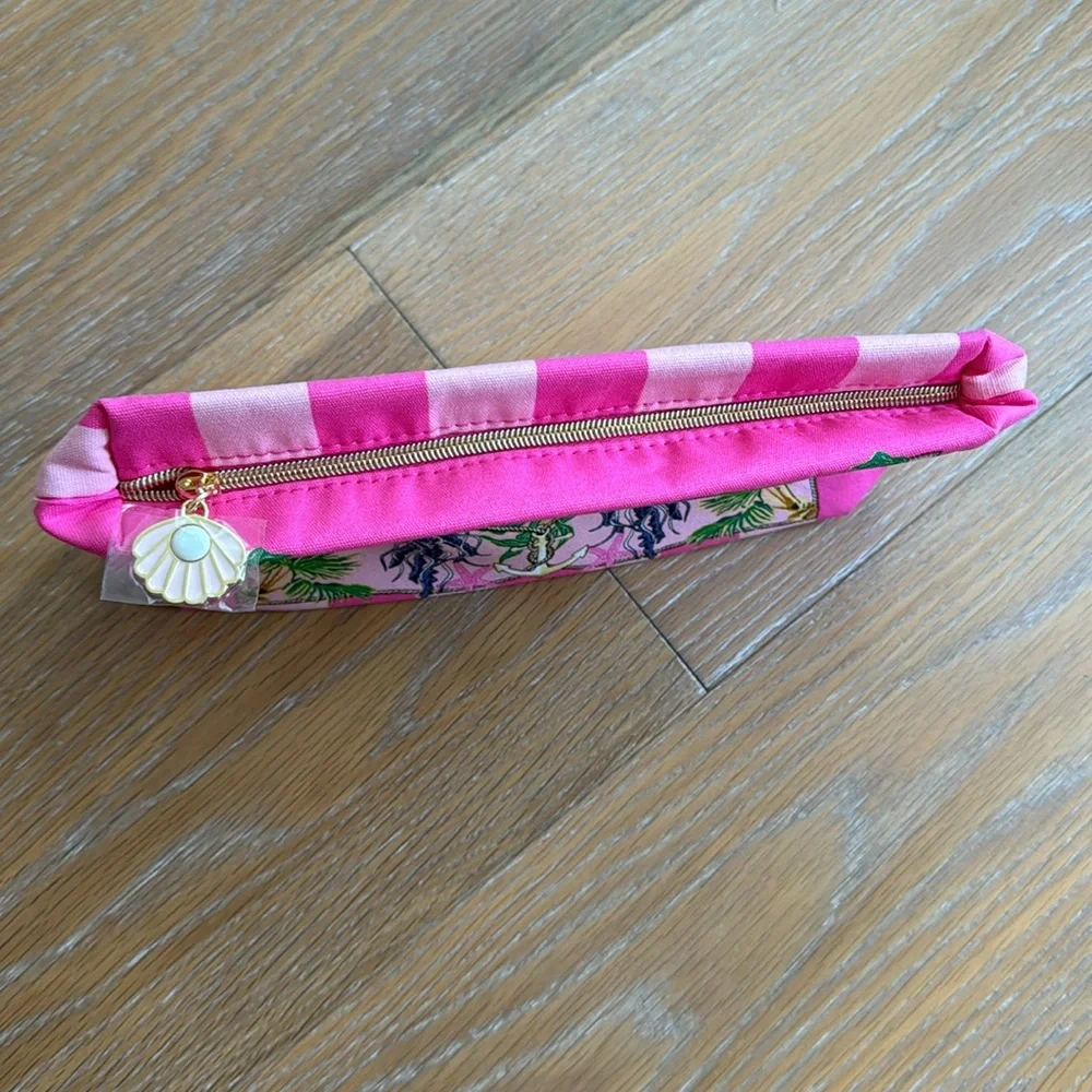 Estée Lauder pink zippered cosmetic bag with sea creatures and tropical trees